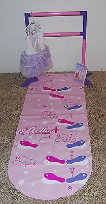 a pink mat with purple and white designs on it, next to a plastic bag