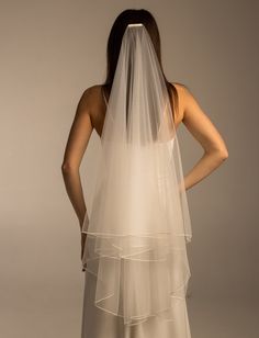 the back of a woman wearing a wedding veil