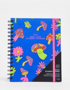 a blue notebook with pink and green flowers on it