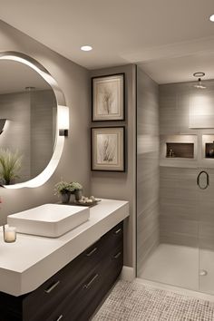 a bathroom with a sink, mirror and shower stall in it's own area