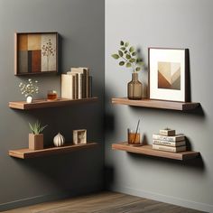 two wooden shelves with books and vases on them in a room that is painted gray