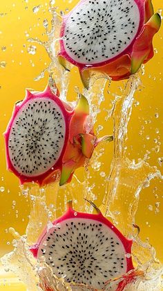 dragon fruit splashing into water on yellow background