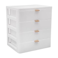 a white dresser with three drawers and gold handles on the bottom drawer, against a white background