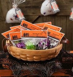 a basket filled with halloween candy sitting on top of a table