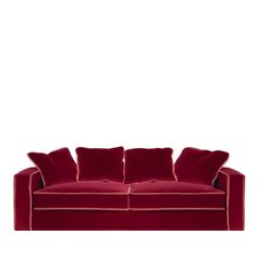 a red couch with four pillows on it's back and one arm facing the camera