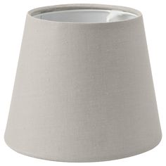 a white lamp shade with a light grey lining on the bottom, and a black dot in the middle