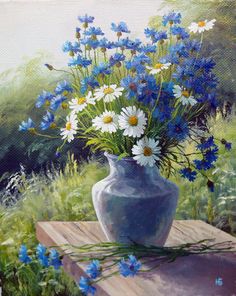 a painting of blue and white flowers in a vase sitting on a wooden table outside