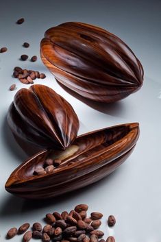 some nuts and seeds on a white surface