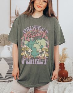 ~ DESCRIPTION: This unisex Hippie Earth Day Comfort Colors Shirt is the perfect addition to your granola girl aesthetic wardrobe. This high quality T Shirt is made with 100% soft-spun cotton with a gorgeous vintage inspired color palette. The soft-washed, garment-dyed fabric brings extra coziness to your wardrobe while the relaxed fit makes it an excellent daily choice. The double-needle stitching throughout the tee makes it highly durable while the lack of side-seams helps the shirt retain its Hippies, Earth Day Shirt, Granola Girl Aesthetic, Cottagecore Mushroom, Aesthetic Shirt, Granola Girl, Aesthetic Shirts, Look Vintage, High Quality T Shirts