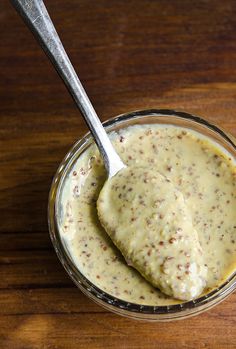 a spoon in a glass jar filled with food