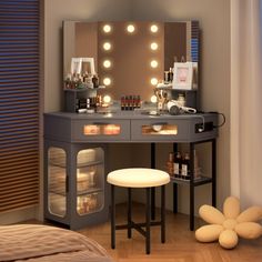 a vanity with lights on it in a bedroom