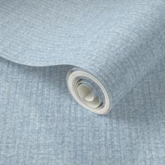 a close up view of a blue fabric with small squares on the top and bottom