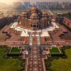 an aerial view of a large building in the middle of a park