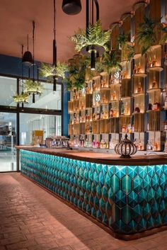 the bar is decorated with green and blue tiles