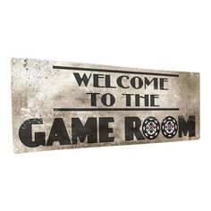 a metal sign that says welcome to the game room on it's back side