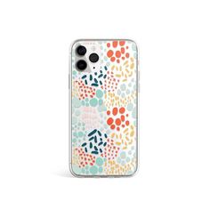 an iphone case with colorful flowers and dots on the front, in clear plastic material