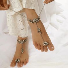 Welcome to our exquisite collection of handcrafted foot jewelry on Etsy! Elevate your style and add a touch of bohemian charm with our stunning range of payal, jhanjar, barefoot sandals, and ankle bracelets - perfect for every occasion, especially for the bride looking to make a statement on her special day. 🌸 Bridal Barefoot Sandals - Elegance for Every Step Enhance your bridal look with our intricately designed barefoot sandals. Crafted with love and attention to detail, these foot adornments feature delicate chains, sparkling crystals, and dainty charms that gracefully wrap around your ankles, creating a mesmerizing and ethereal effect. Make a bold and beautiful statement as you walk down the aisle. 🌿 Bohemian Payal and Jhanjar - Embrace Your Inner Free Spirit Capture the essence of b Dainty Sandals, Anklets Beads, Wedding Anklets, Leg Chain, Silver Anklets, Foot Jewelry, Anklet Jewelry, Oxidized Silver, Body Jewellery