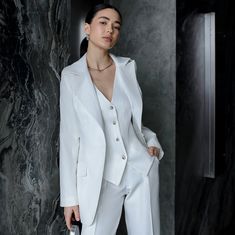 Elevate your bridal style with our sophisticated white women's 3-piece suit, tailored to perfection for your special day. This trendy ensemble features a chic vest and jacket paired with sleek straight pants, exuding modern elegance. Perfect for both traditional and contemporary weddings, our bridal suit embodies timeless sophistication while offering a touch of trendiness. Whether you're walking down the aisle or celebrating love in all its forms with our lesbian wedding suit option, this versa 3 Piece Suit Women Wedding, Arequipa, Wedding Suit White Woman, Women White Suits, Lesbian Bridal Outfit, White Bride Suit, White Suit Wedding Women, Female Wedding Suits, Feminine Suits Wedding