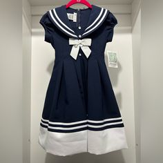 New With Tags Size: 8 1940s Sailor Dress, Preppy Navy Cotton Dress, Blue Cotton Sailor Dress, Blue Sailor Cotton Dress, Blue Sailor Style Cotton Dress, Summer Short Sleeve School Uniform Dress, Summer School Uniform Dress With Short Sleeves, Sailor Style Blue Cotton Dress, White Cotton School Dress