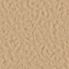 an image of sand with footprints on it