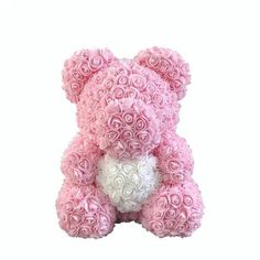 a pink and white teddy bear made out of roses