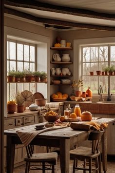 a kitchen filled with lots of counter top space next to a wooden dining room table