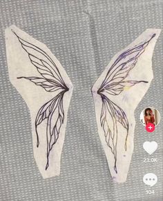 an image of two butterfly wings on a piece of fabric with the applique added