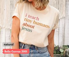 Teaching Kids About Jesus Best Job Ever T-Shirt, Jesus Tee, Godly Mom Shirt, Gift for Religious Women, Bible Study Teacher Shirt, Mom Shirt, Trending Shirt, Unisex Soft Cotton Tee Welcome to my store! I will help you to have a good shopping experience as much as I can. If you have any request (design customization, more size and color options) please feel free to message me. I will reply as soon as possible. I have listed some information to help you below:  HOW TO ORDER  * Please, Check and Rev Inspirational Cotton Tops With Funny Text, Christian Teacher Shirts, Teacher Christian Shirt, White Cotton T-shirt For Teaching, Yal Needs Some Jesus Shirt For Kids, What Would Jesus Do Shirt, Inspirational Cotton T-shirt With Funny Text, Volunteer Shirt, Groovy Christian Shirts