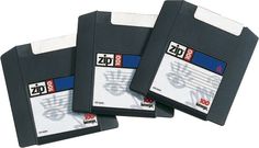 three floppy disks are stacked on top of each other, with the word zip printed on them