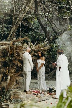 a couple getting married in the woods