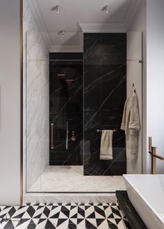 a black and white tiled bathroom with marble flooring, shower stall and bathtub