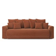 a brown couch with six pillows on it and one arm folded back to the side