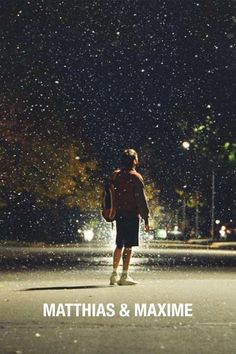 a person walking in the rain at night