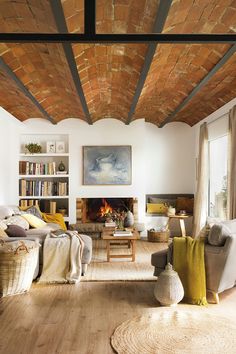 a living room filled with furniture and a fire place