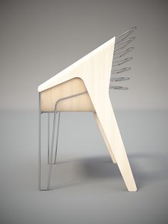 a chair made out of wood with metal legs and an upside down design on the back