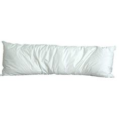 a white pillow sitting on top of a bed