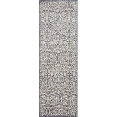 a large rug with an intricate design on the bottom and blue, white and grey colors