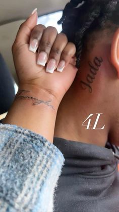 a woman with tattoos on her neck and arm