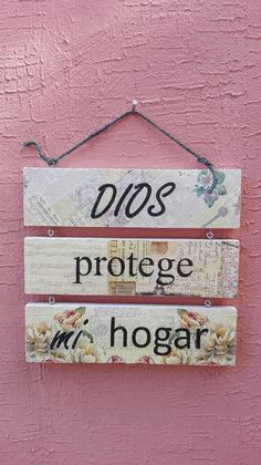 two wooden signs hanging on the side of a pink wall that says do's protect mr hogr and mrs hogr