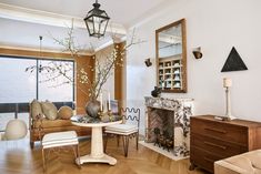 a living room filled with furniture and a fire place