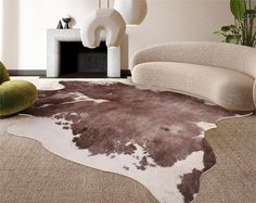 a living room with a cow hide rug on the floor