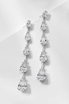 Introduce glamour to your look with these multi-CZ earrings. The graduated pear-shaped stones create a dazzling display that will draw the eye and sparkle with every movement. Dangly Diamond Earrings, Wedding Earrings Bride, Diamond Earrings Wedding, Bride Earrings, Modern Love, Cz Earrings, Fine Jewellery Earrings, Wedding Earrings, The Eye