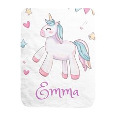 a white towel with a pink and blue unicorn on it