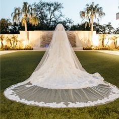 a bride's veil is draped over her wedding dress