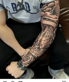 a man with a tattoo on his arm