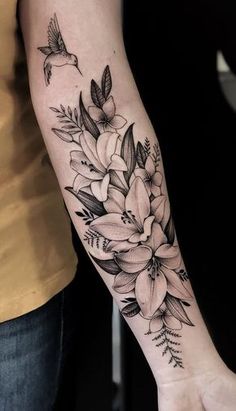 a person with a flower tattoo on their arm