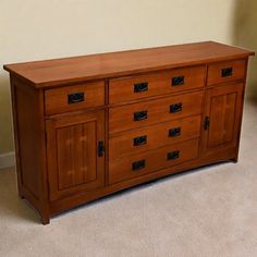 a large wooden dresser sitting on top of a carpeted floor