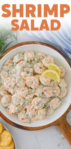 shrimp salad in a bowl with crackers on the side