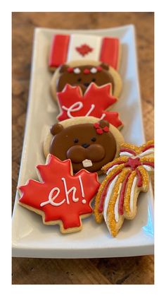 decorated cookies on a plate with maple leaves