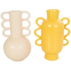 two yellow and white vases sitting next to each other